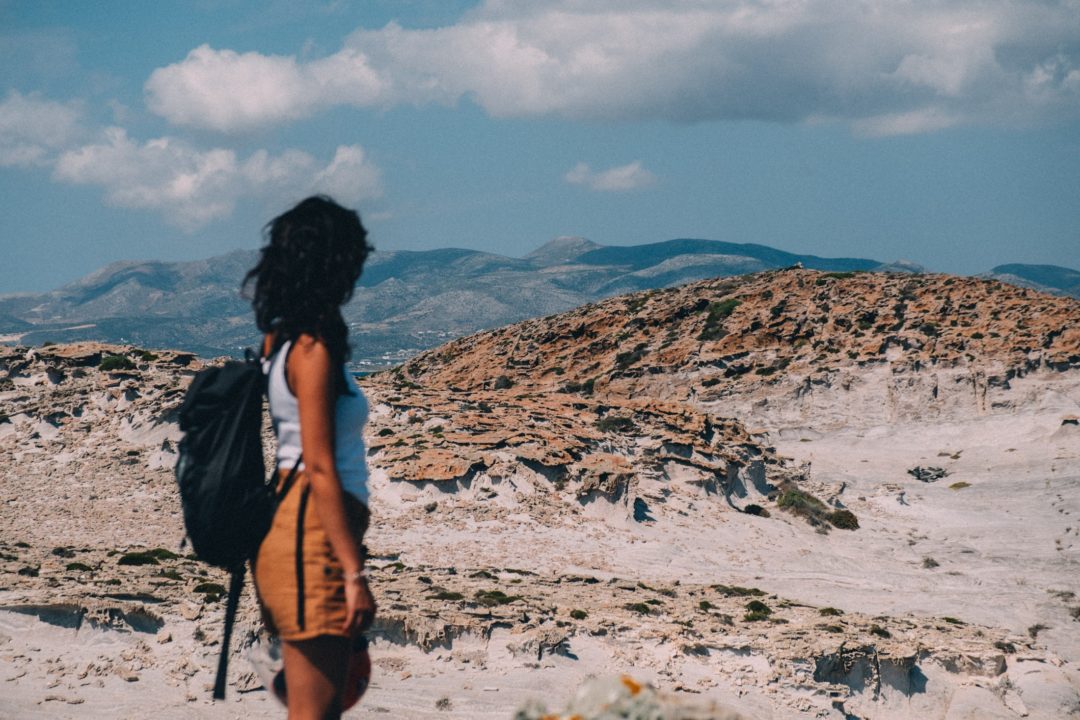 woman-looking-out-at-desert